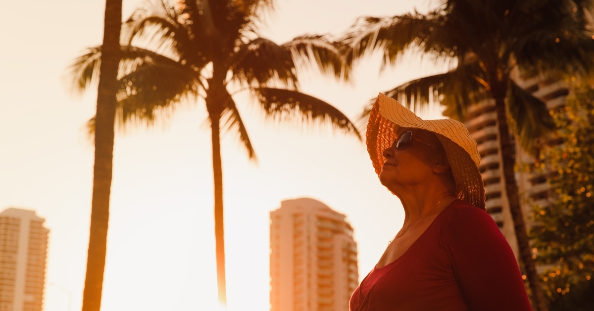 happy senior woman at tropical beach