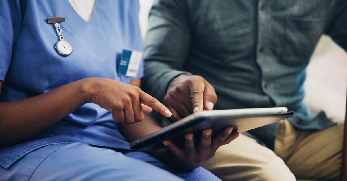 Nurse and patient on tablet