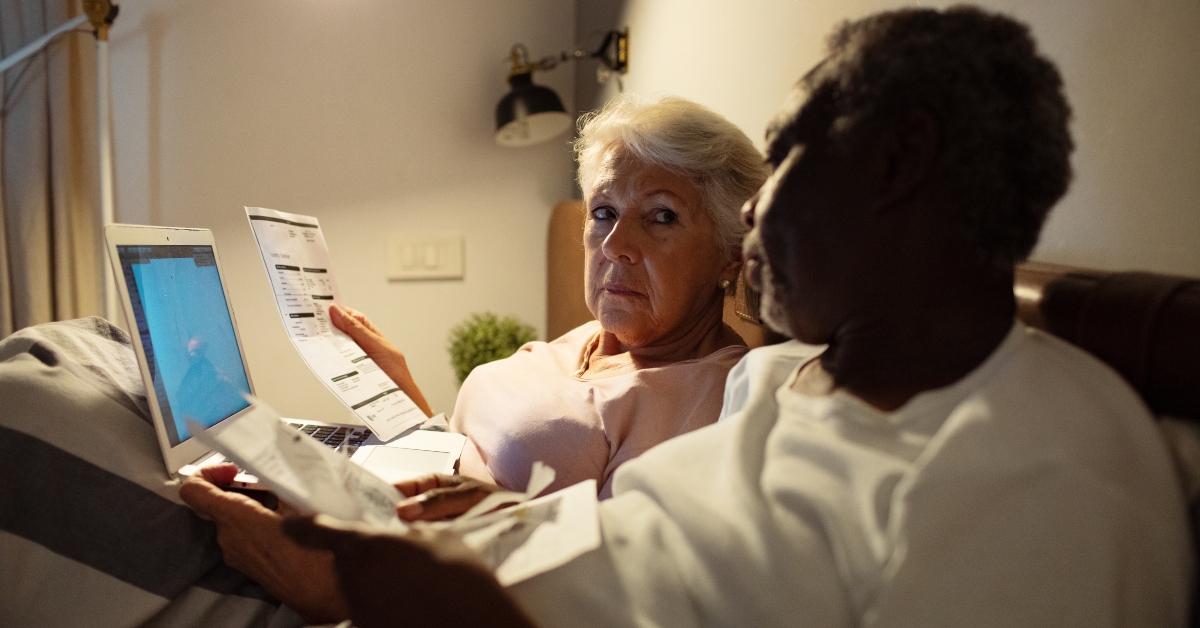 Senior couple reviewing bills