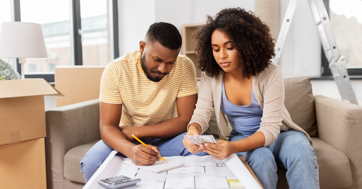 african american couple calculating mortgage bills