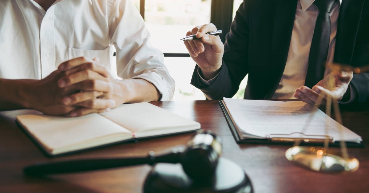 lawyer discussing case with client in court