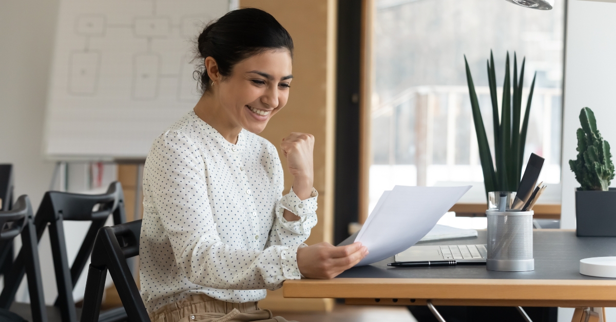 Woman reading paper letter