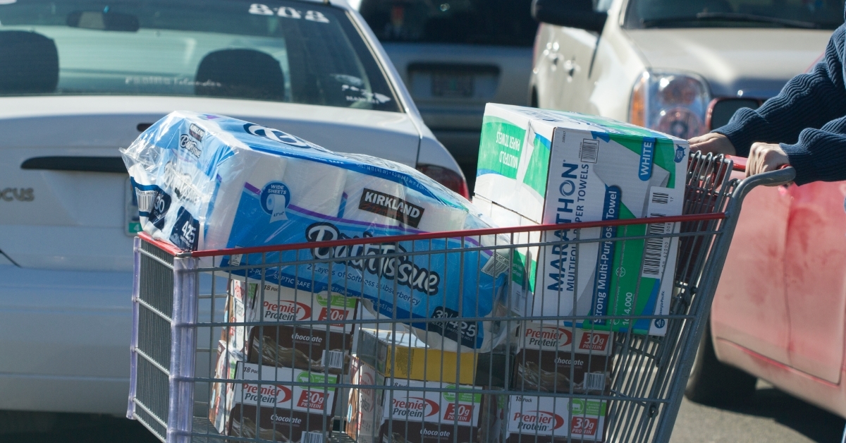 shopper pushing grocery cart outside costco