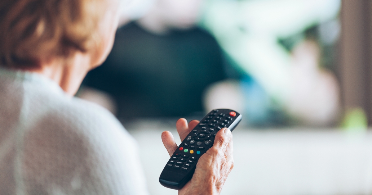 woman with remote control watching