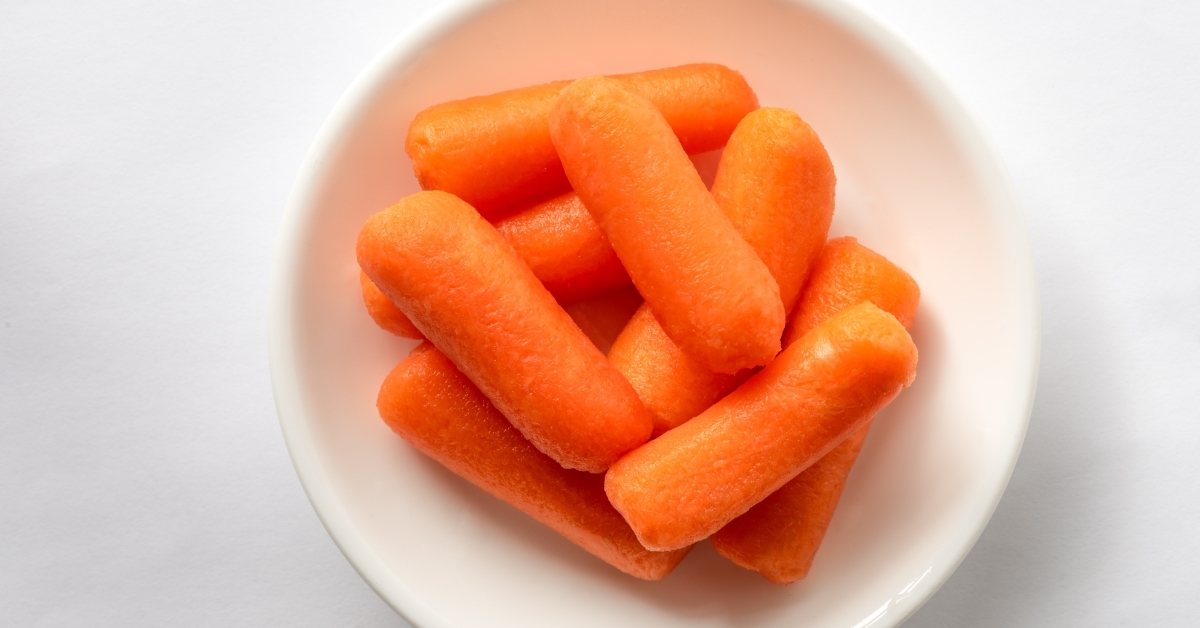 Mini Orange Carrots on white plate