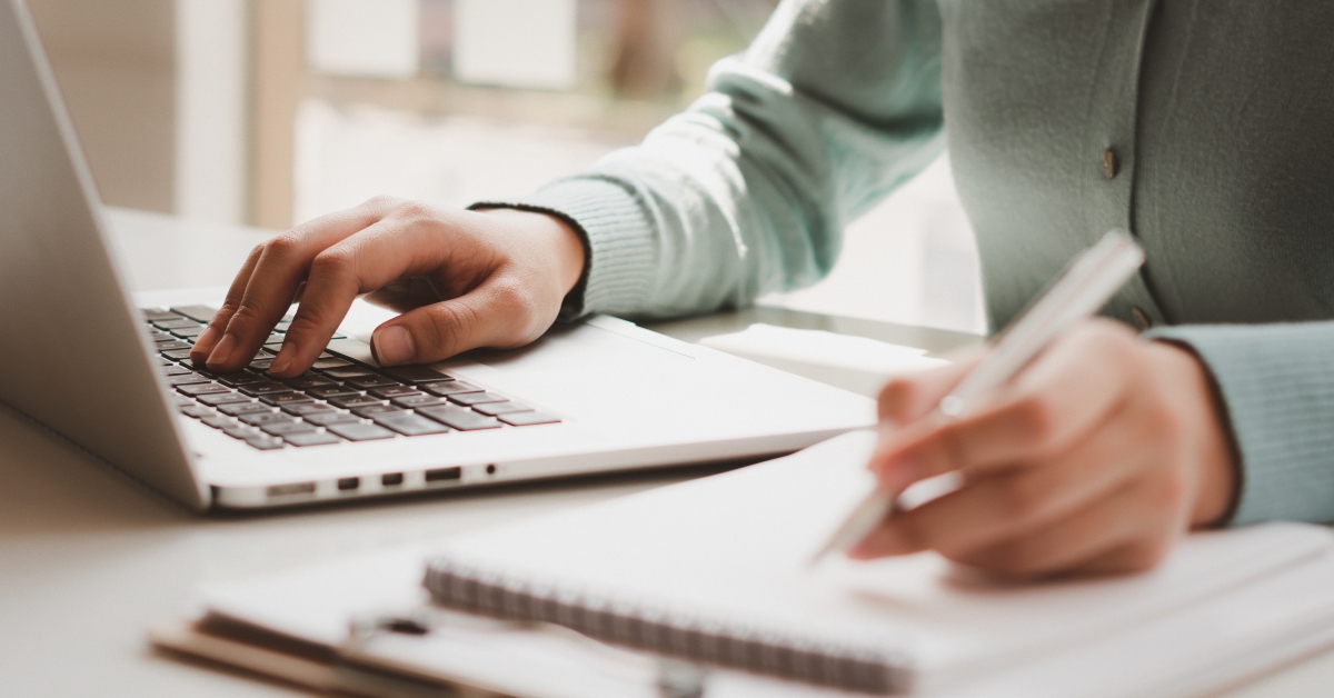 Business women work on computers