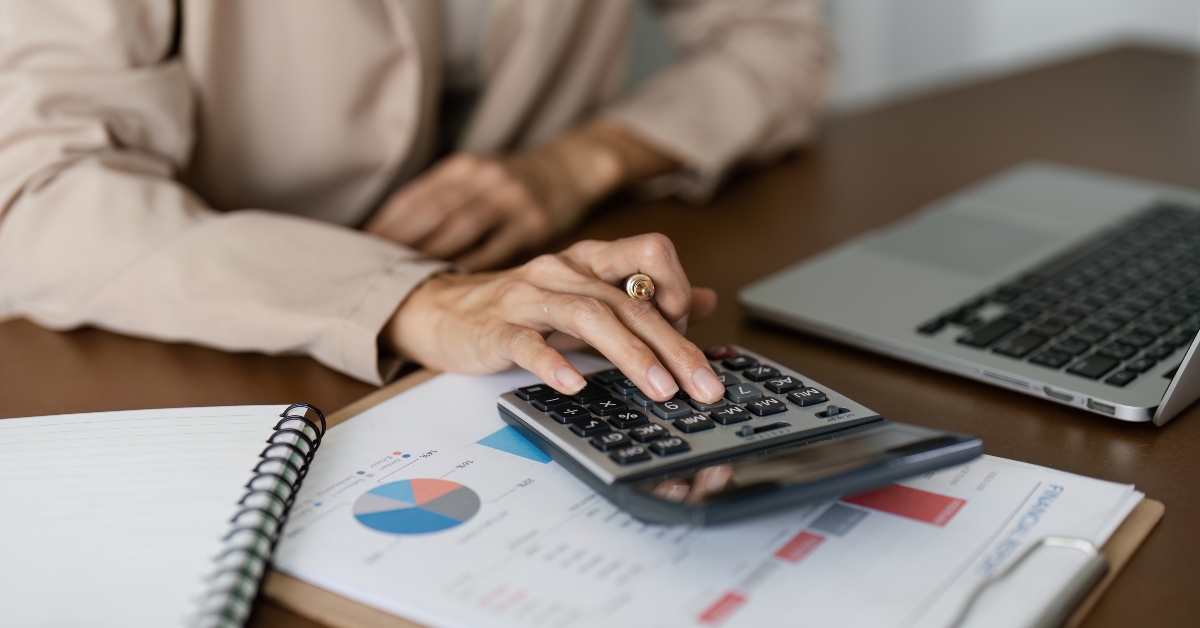 Businesswoman using a calculator