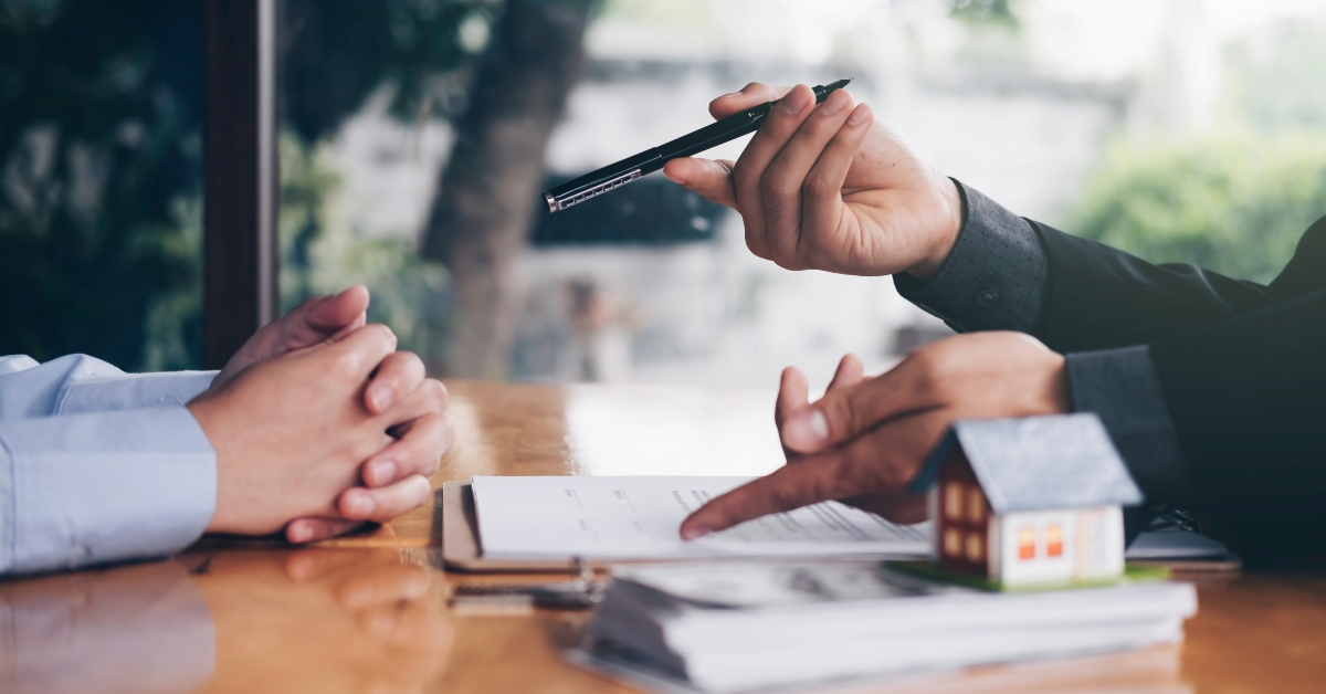 Estate agent talking to client