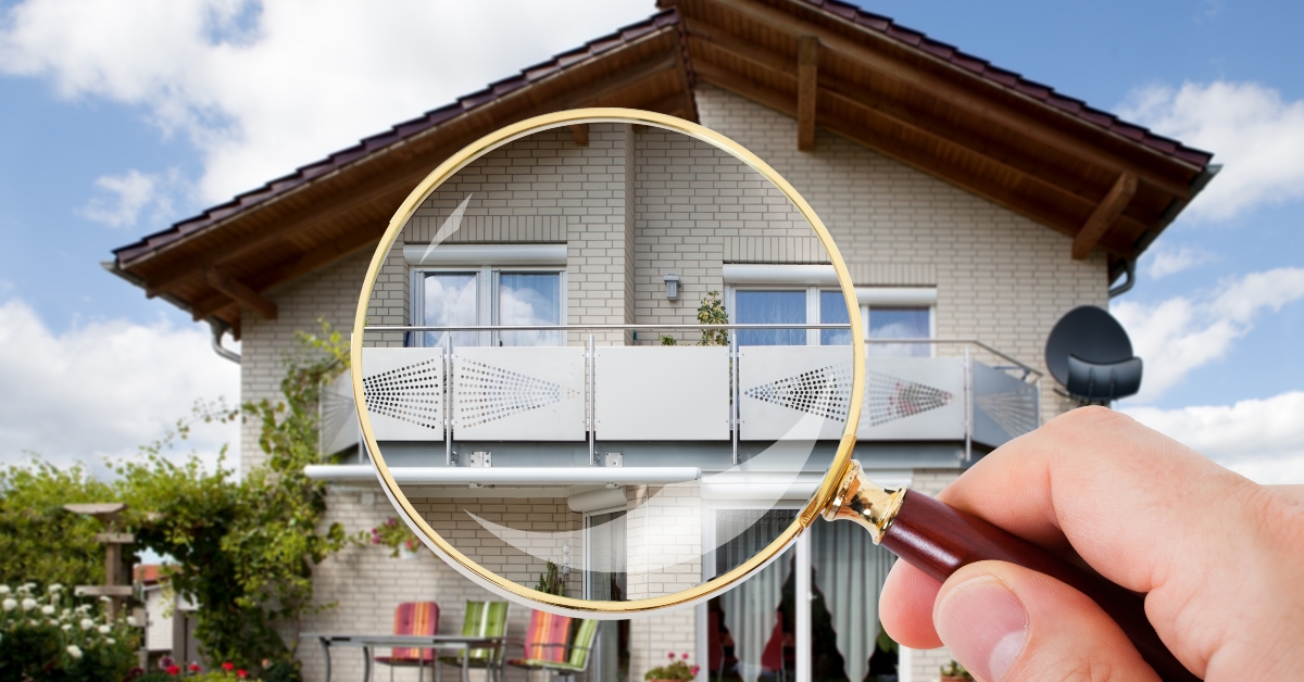 magnifying glass over house