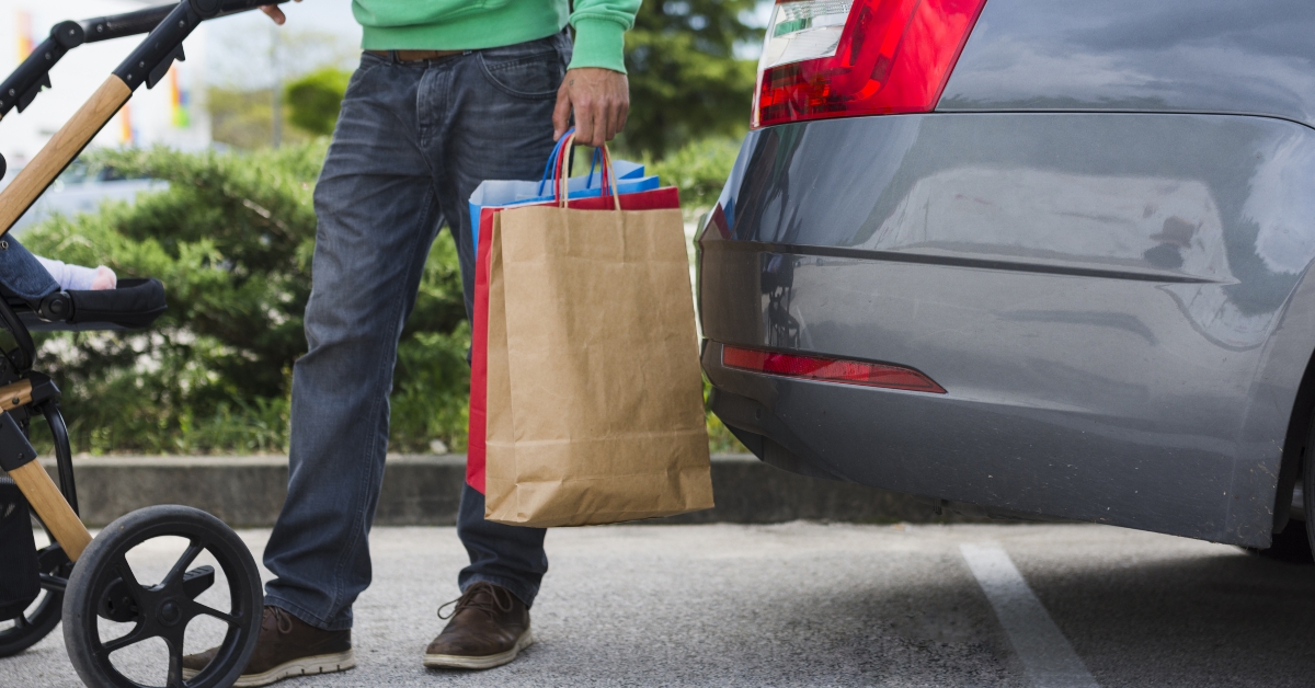 Person keeping shopping bags