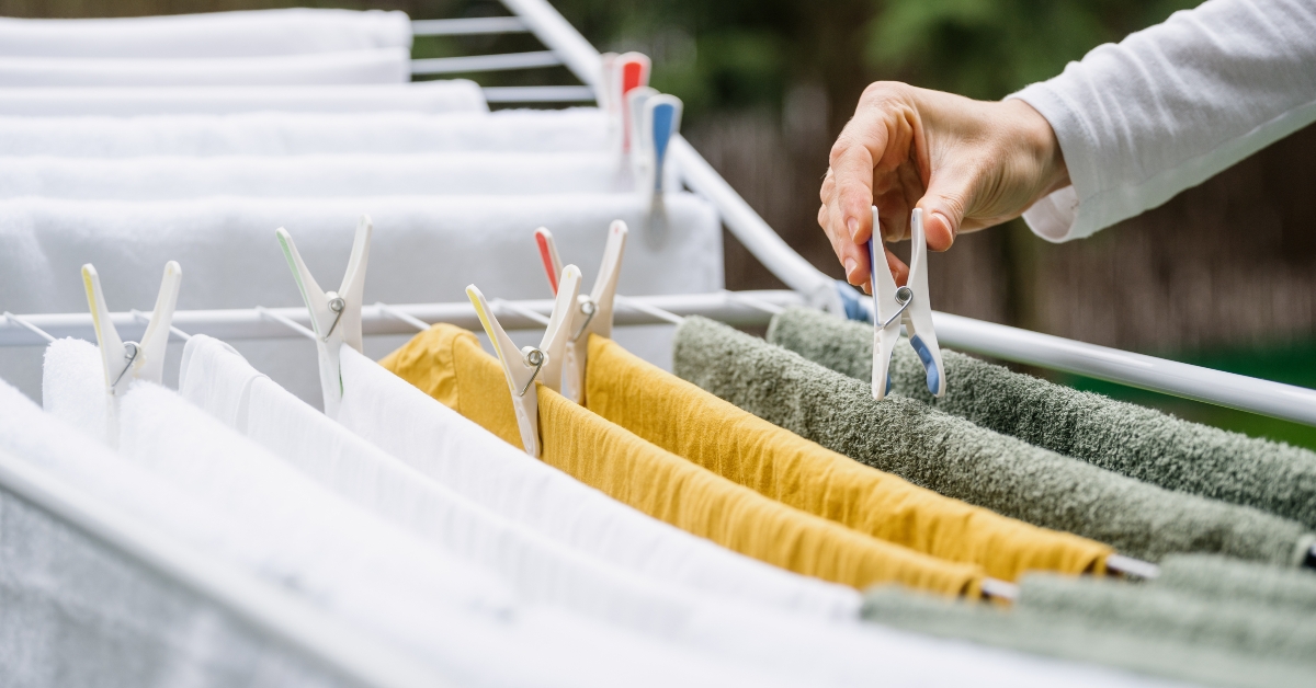 Woman hanging clean wet clothes
