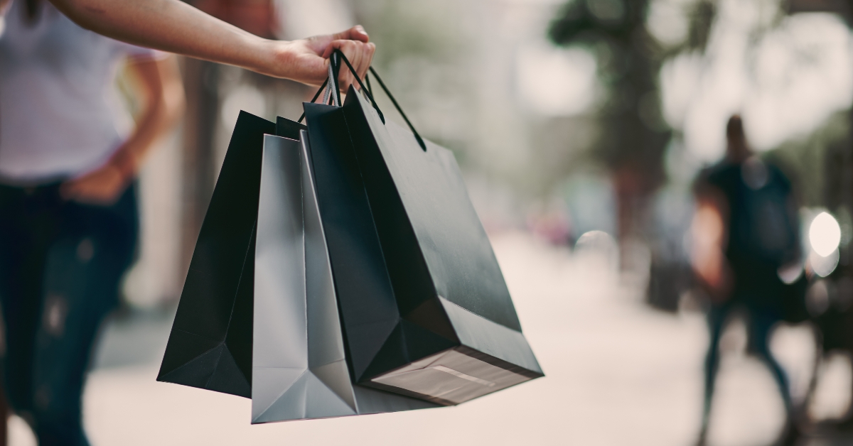 holding shopping bags