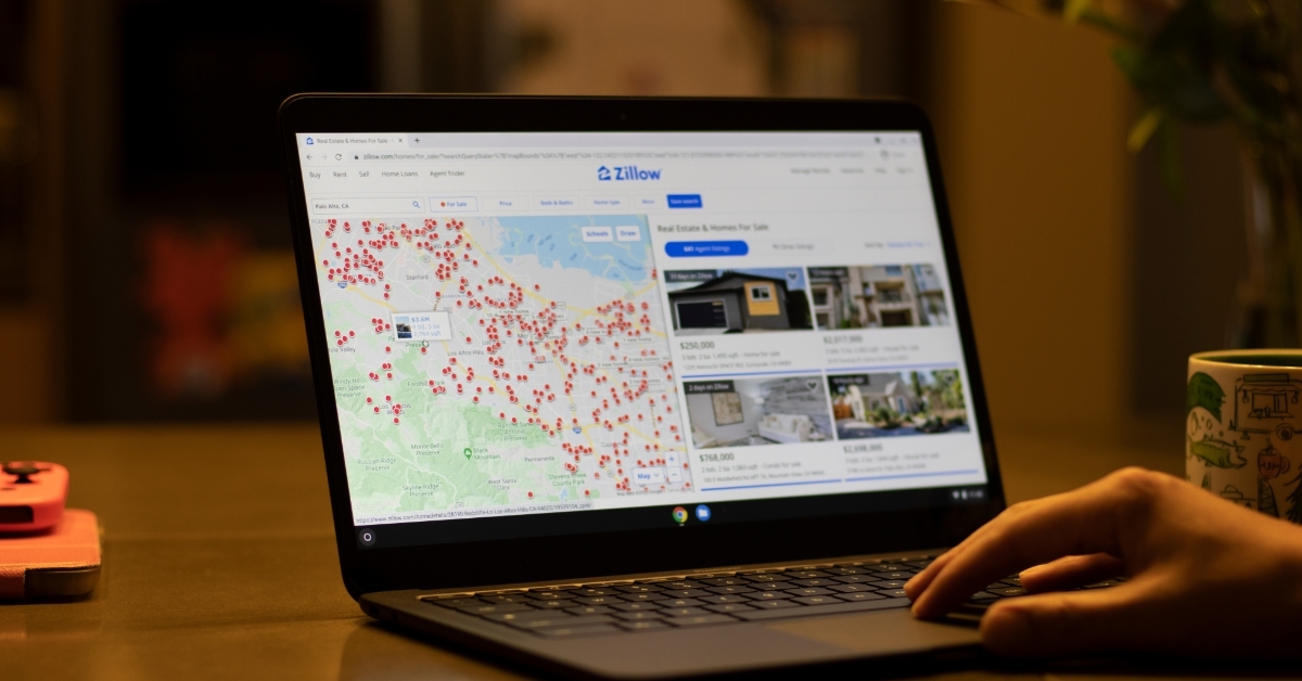 man searching family house on zillow website