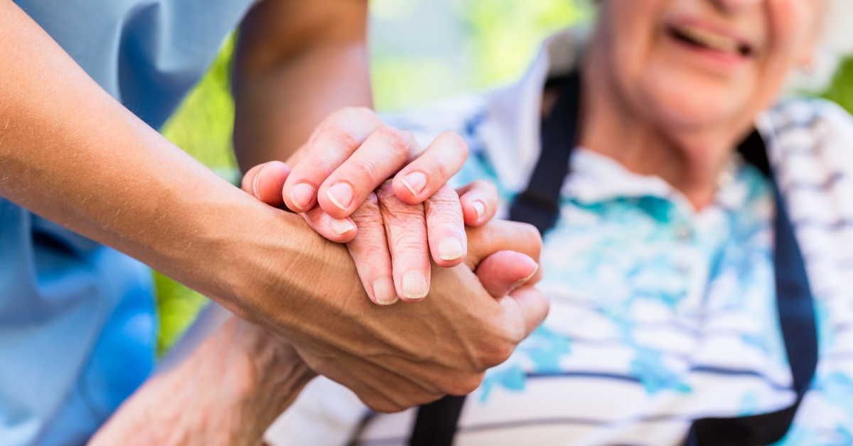 Nurse consoling senior woman