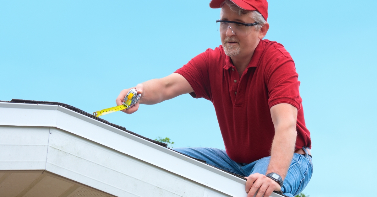 Wind mitigation inspector doing inspection