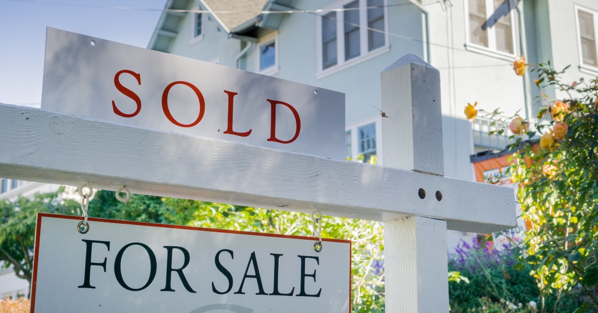 Sold sign in front of a house