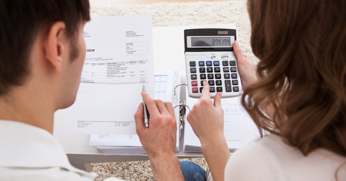 Young couple calculating budget