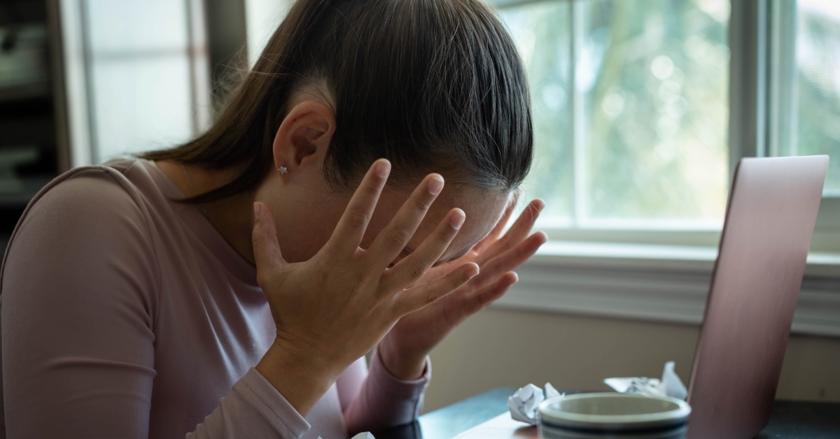 frustrated woman working on computer