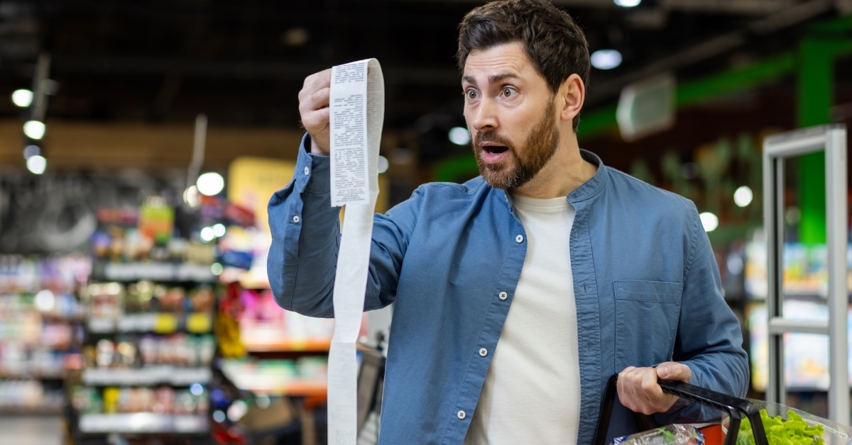 man shocked at long grocery bill