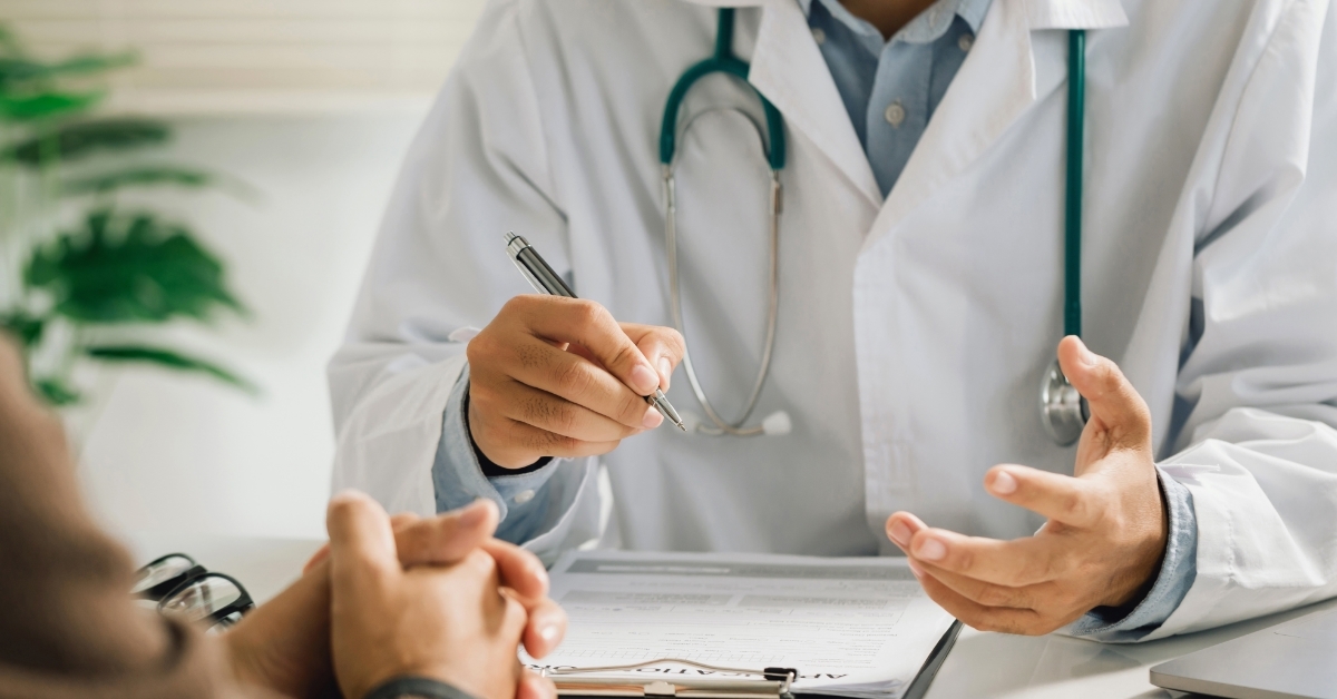 physician talking to patient at clinic