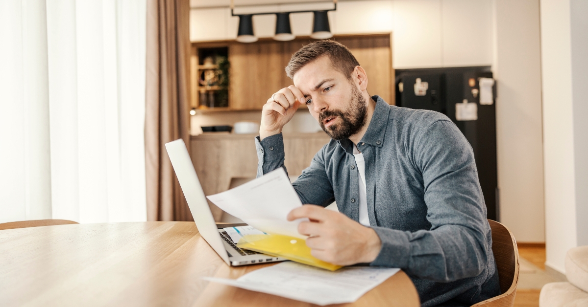 Man preparing to pay bills online