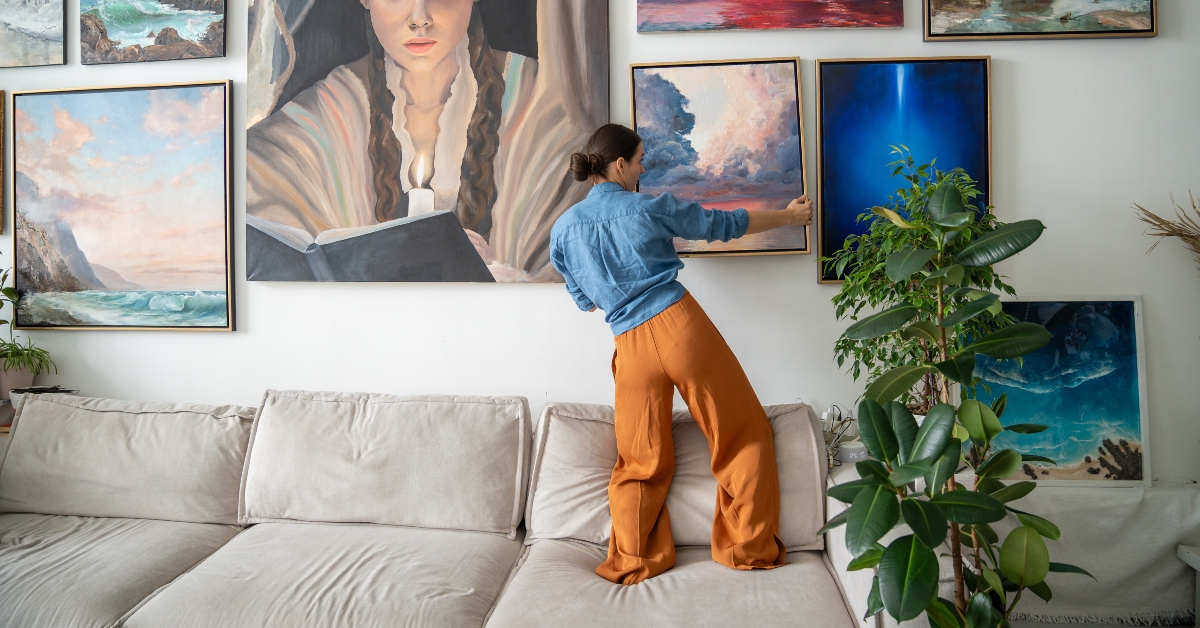 Painter, hangs trendy artwork