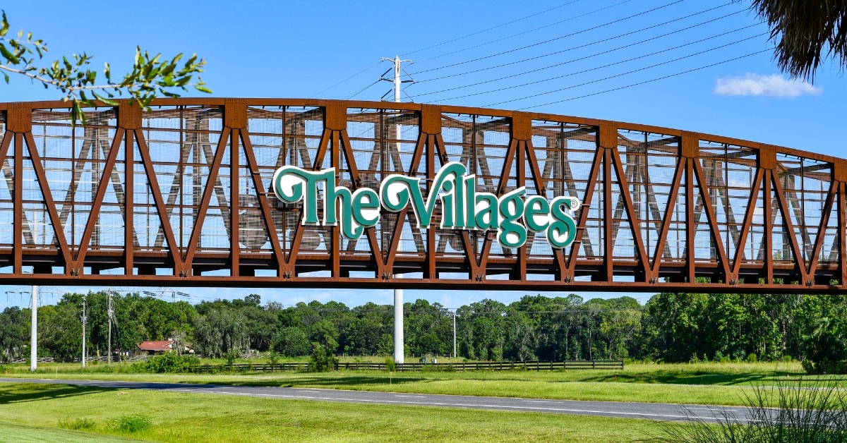 the Villages sign over Steel bridge
