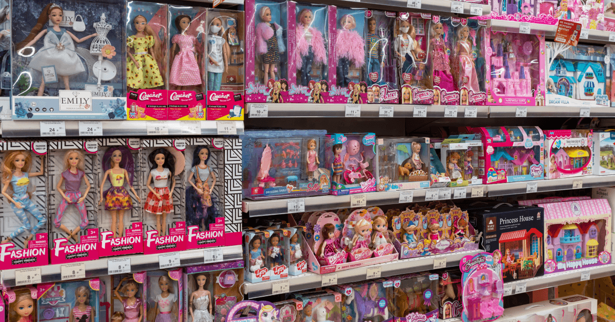 Shelves with dolls for children in a toy store