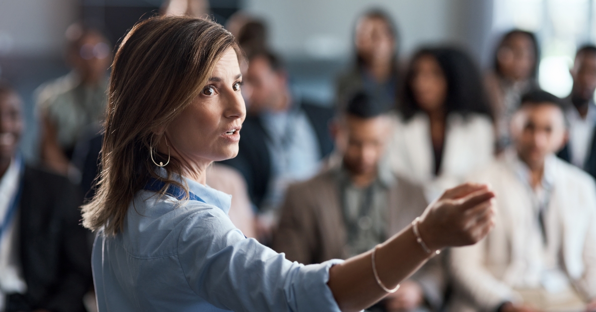 woman talking to an audience 