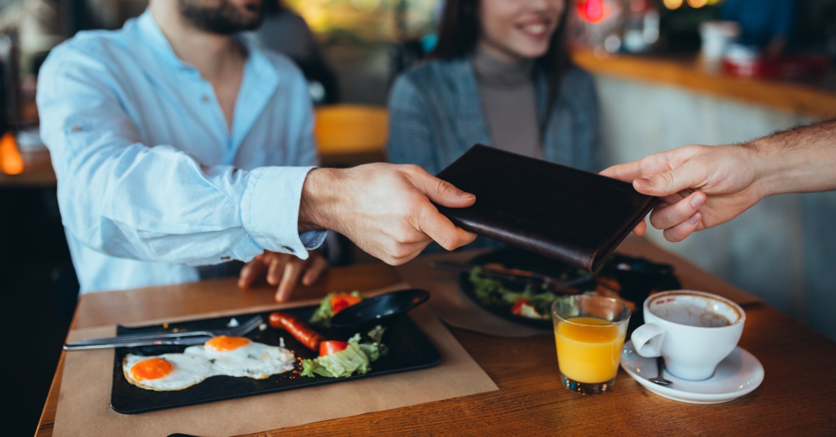 Man paying bill with cash