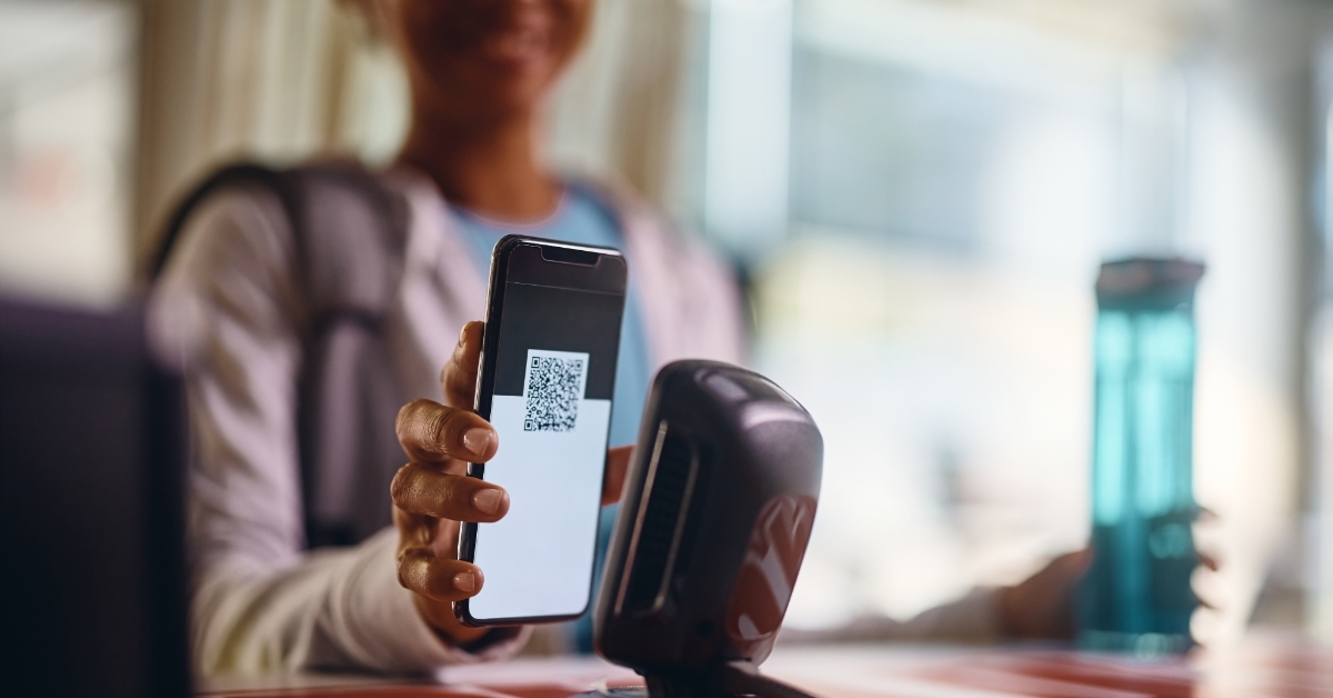 athlete scanning QR code at gym reception