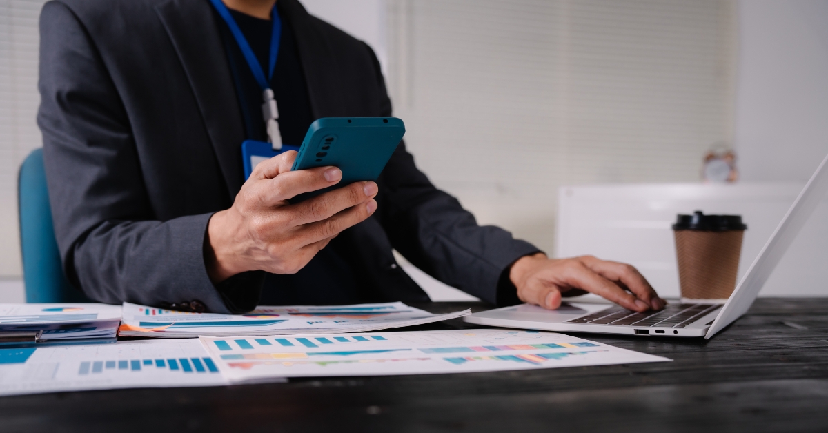 Businessman sits at his office desk