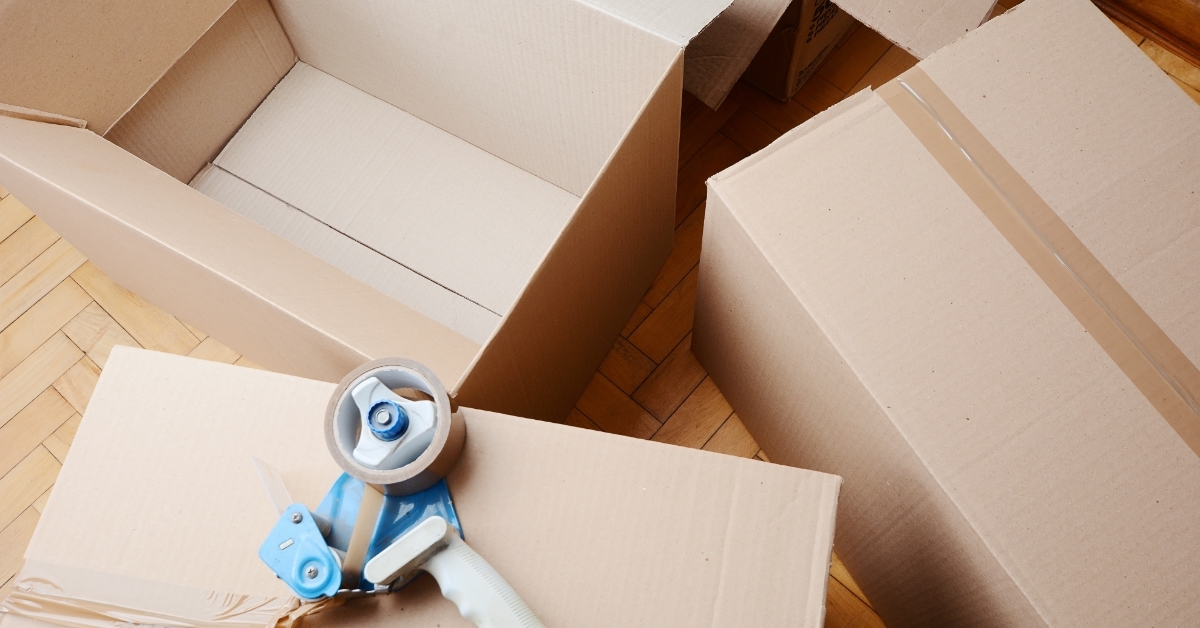 Tape dispenser over cardboard box