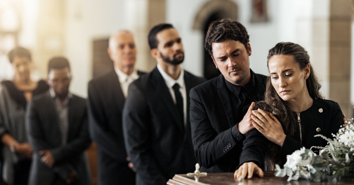  family touching coffin 