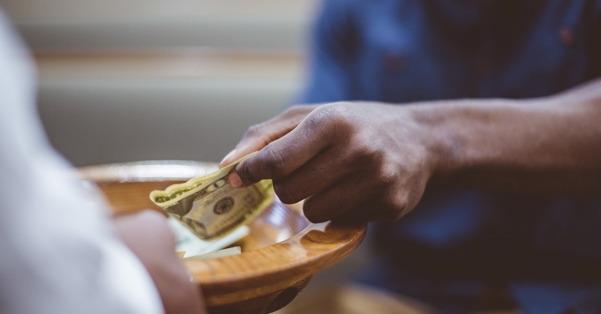 Male donating money for church
