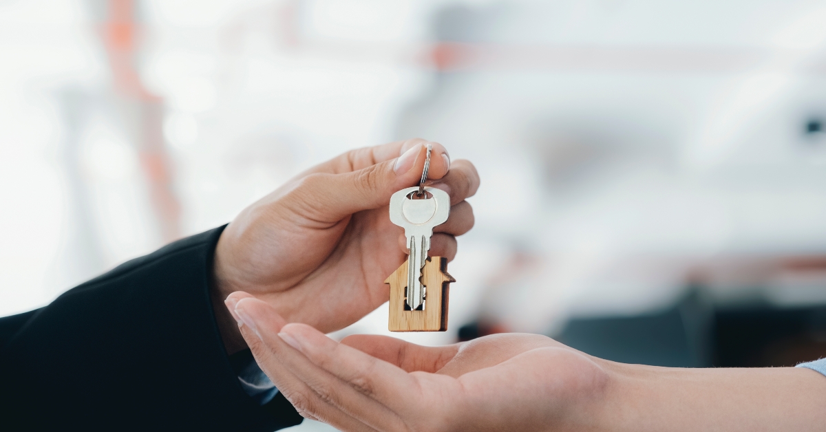 Real estate agent holding key