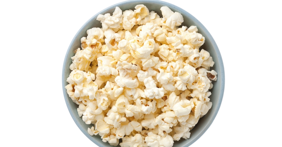 bowl with popcorn on white background
