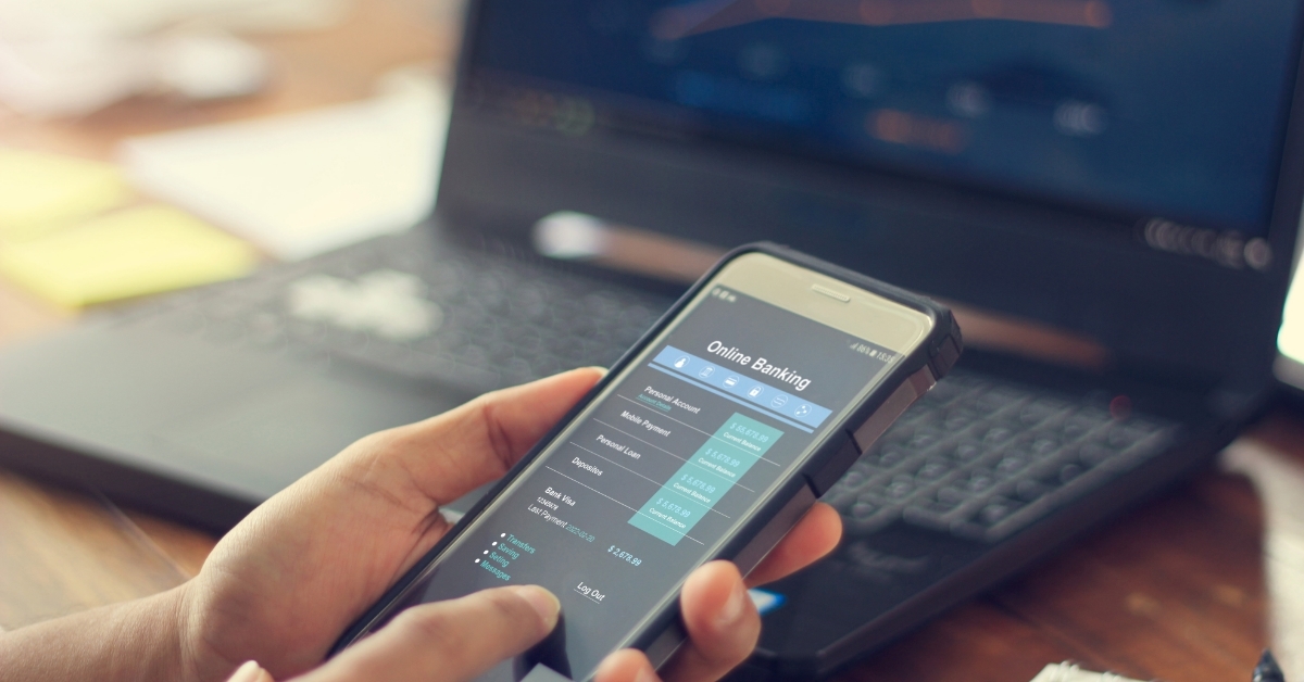 Businessman using online banking services on smartphone