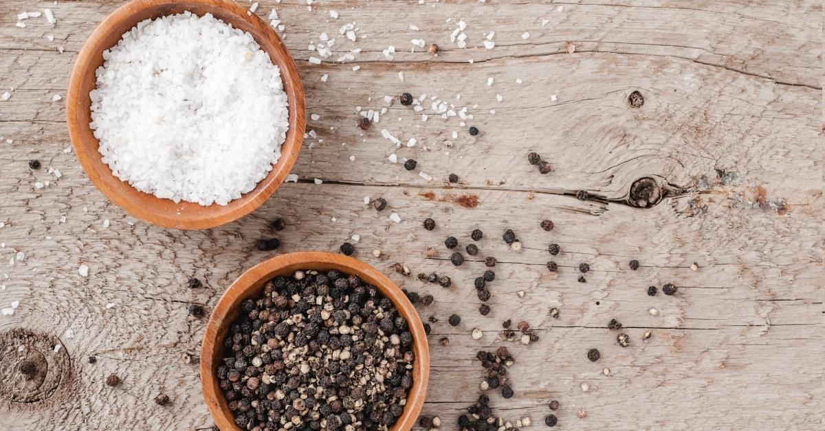 salt and pepper on wooden background