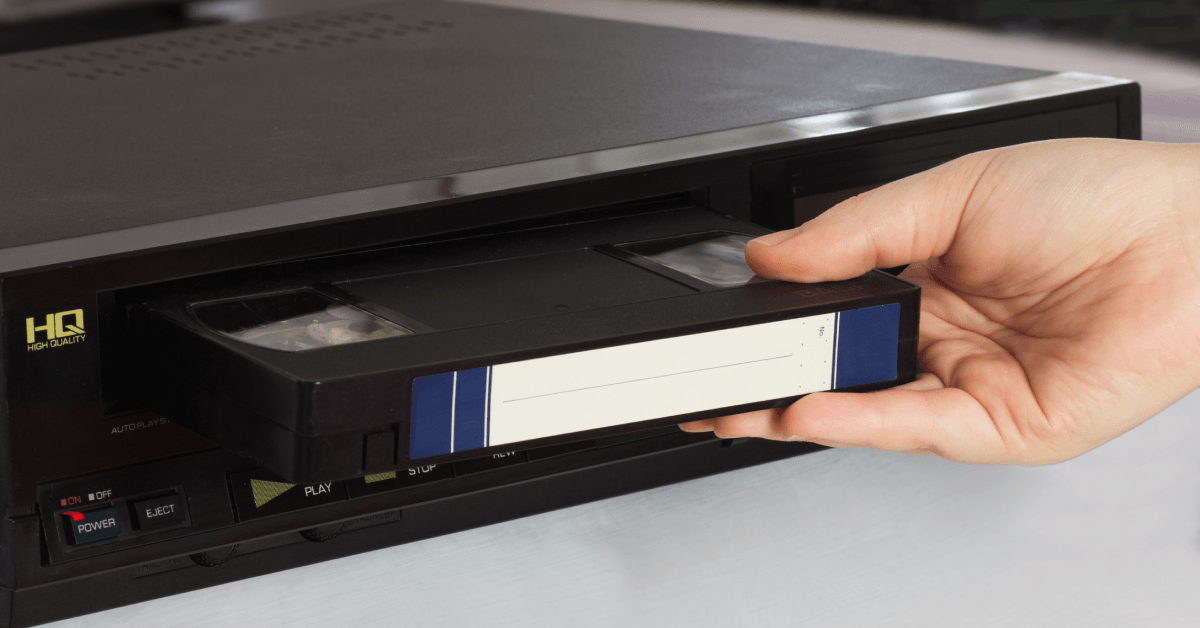 Inserting VHS tape into player 