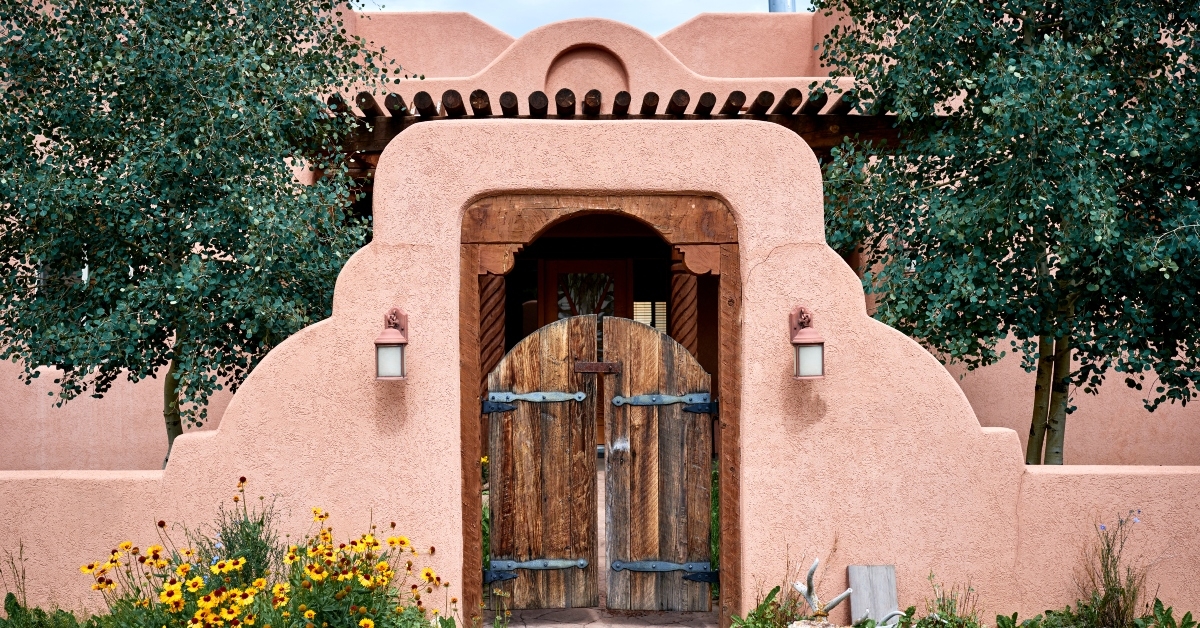 adobe building with a wooden gate