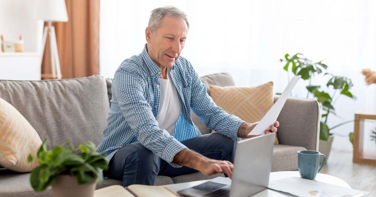 senior man reading report