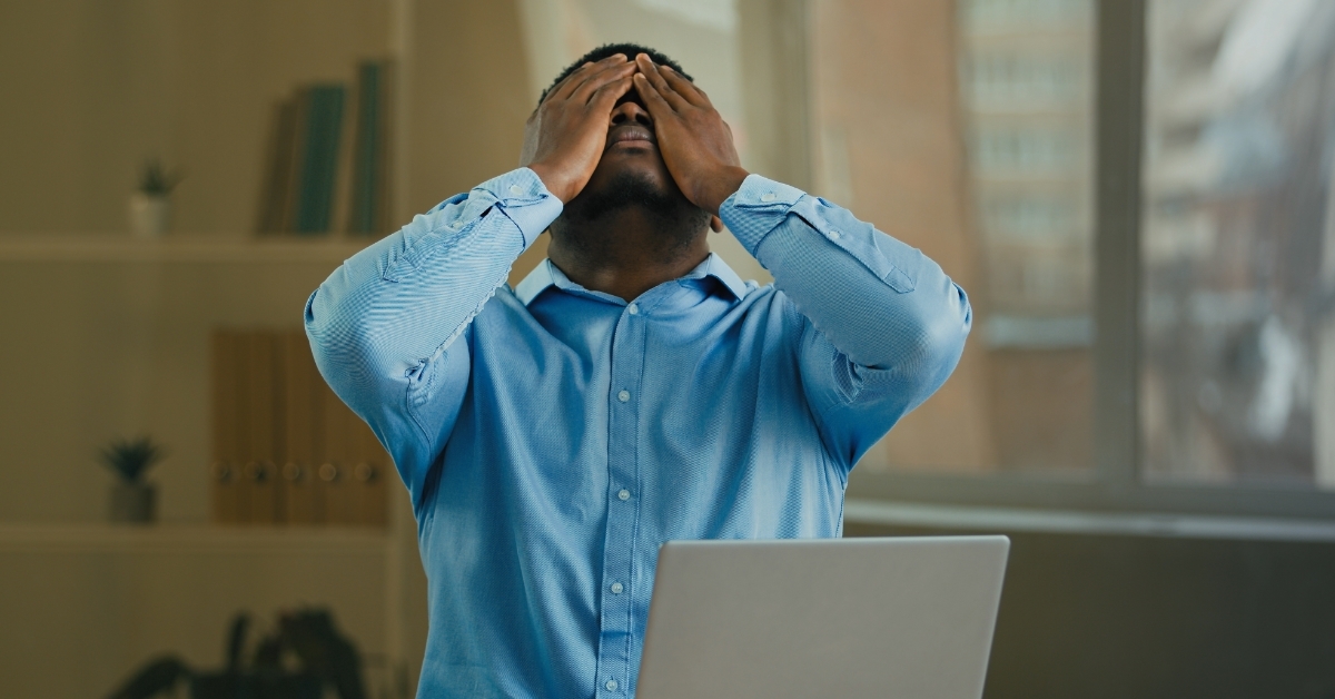 depressed african american employee at work