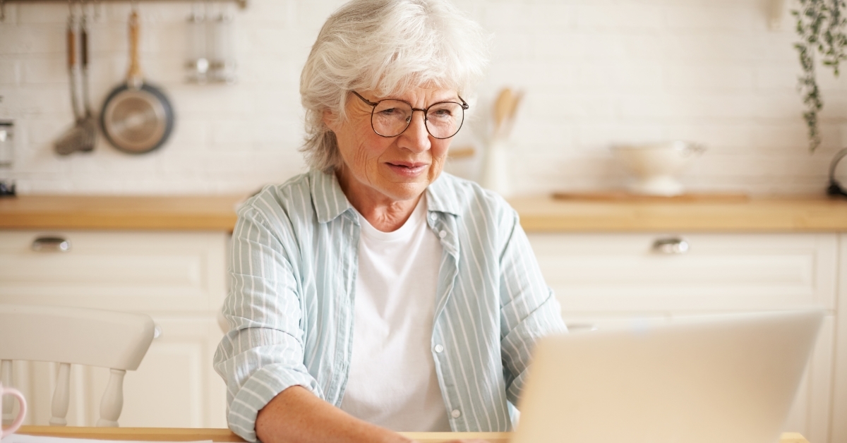 senior woman using laptop electronic concept