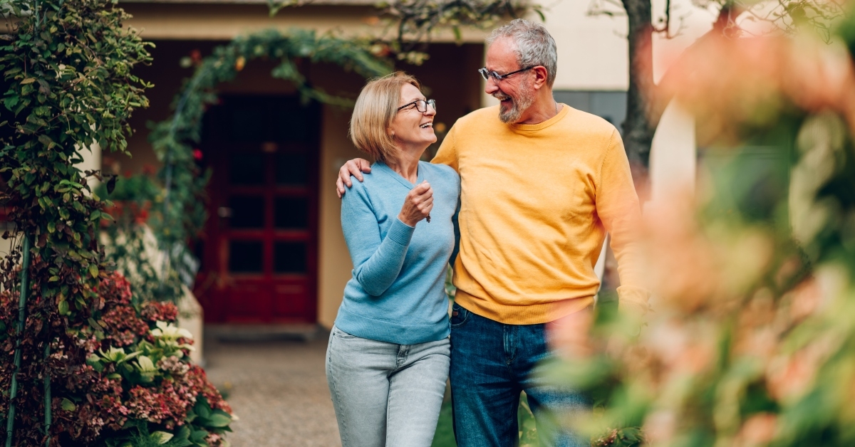 senior couple holding keys