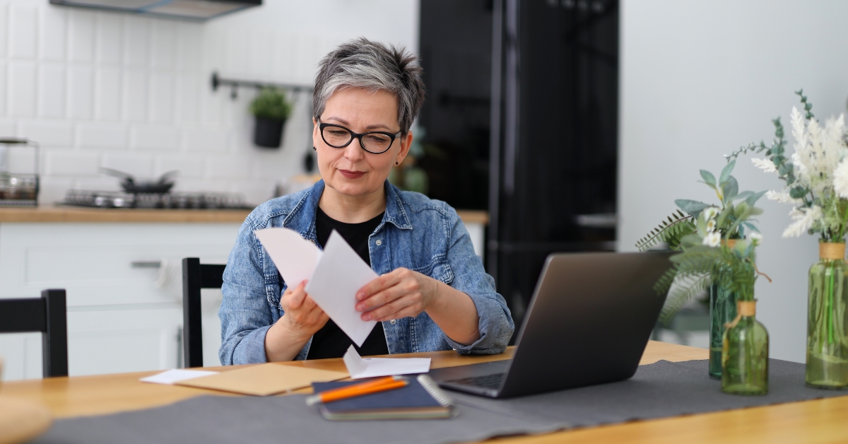 woman checking mail and bank accounts