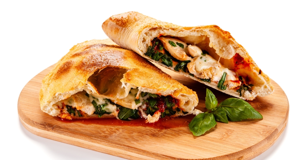 Pizza calzone on cutting board