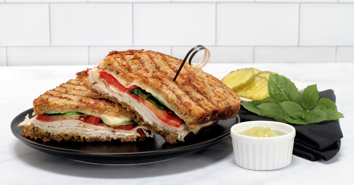 Turkey basil provolone cheese tomato panini