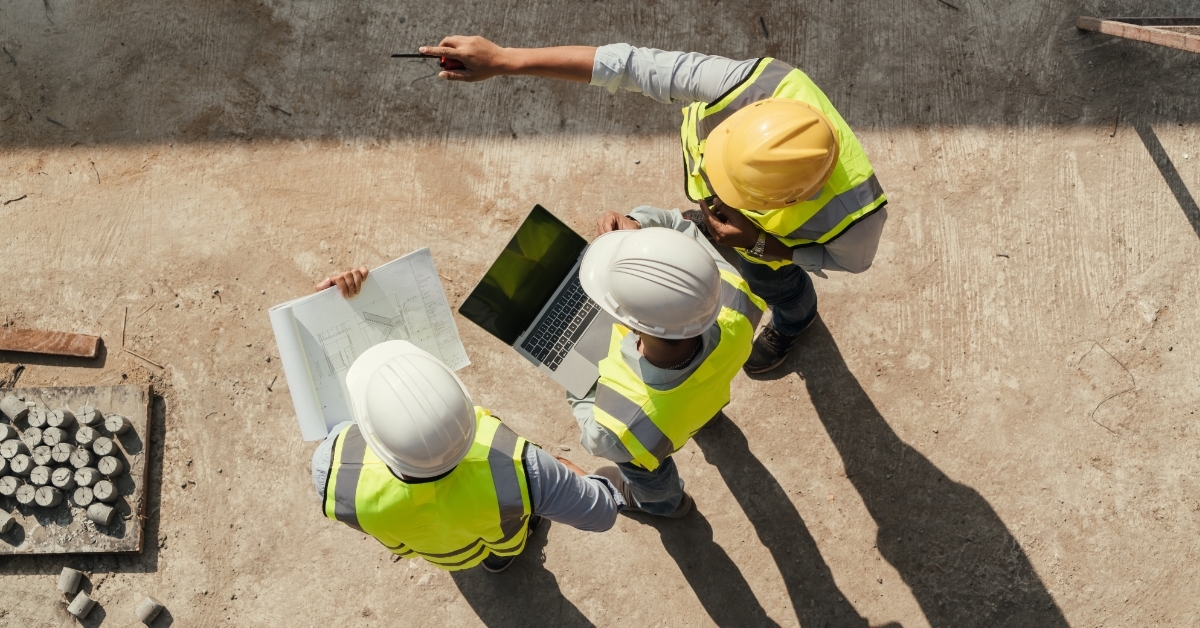 engineers inspecting building use laptop 