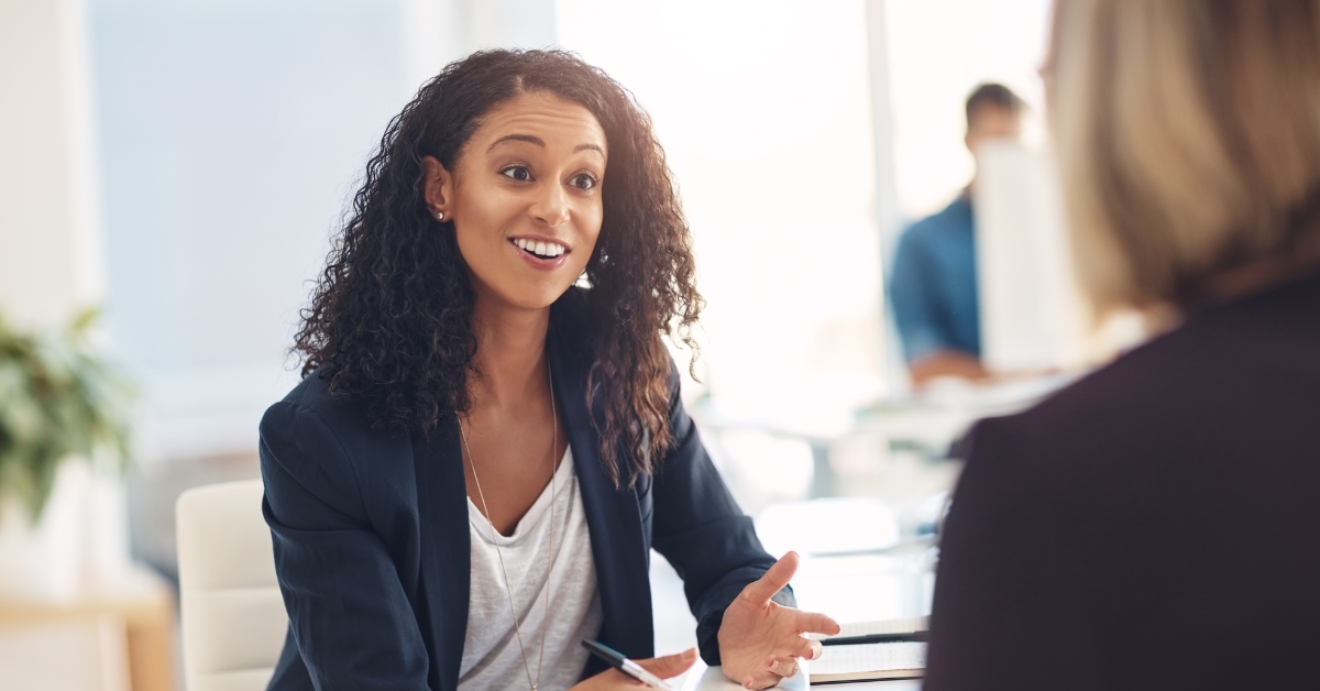 Female manager interviewing happy candidate 